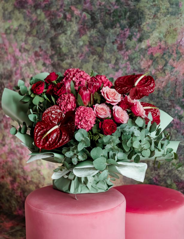 Pink Hydrangea, Burgundy Anthurium, Pink Rose & Purple Tess Rose in this stunning bouquet!