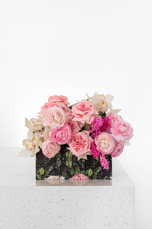 Mix of pink roses and cymbidium orchids in a mini Bliss rectangular box
