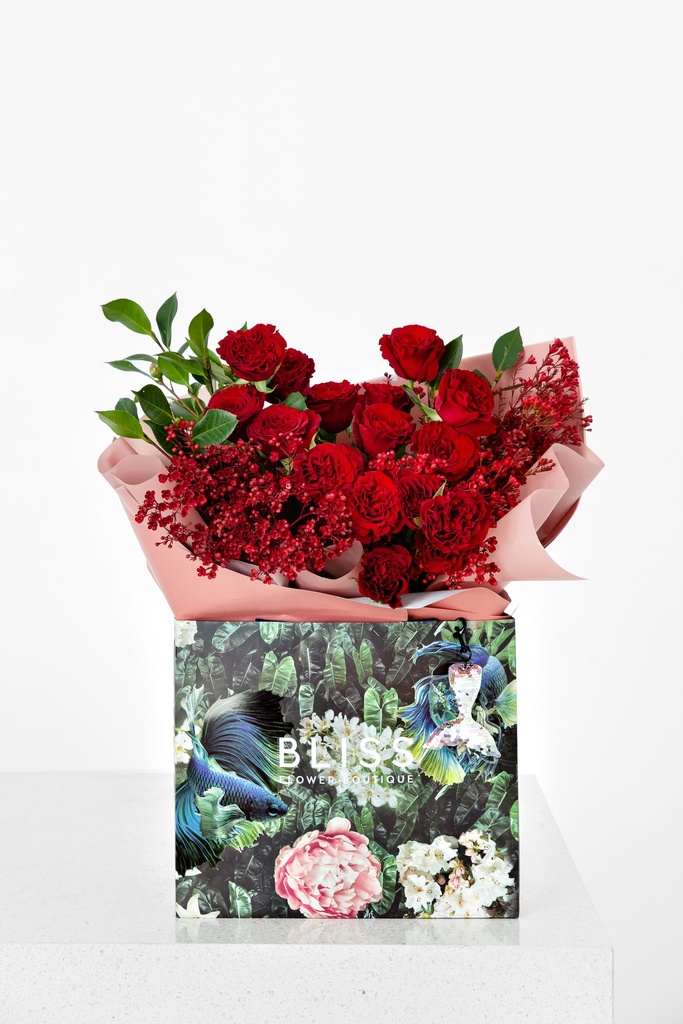 Mix of red flowers with roses and asparagus