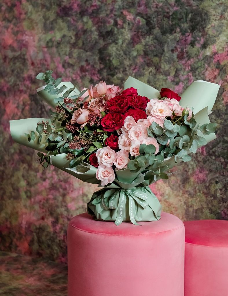 Red, pink and dusty pink roses with eucalyptus